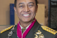 Karen Durham-Aguilera (left), executive director, Arlington National Cemetery and Army National Military Cemeteries; and Indonesian Army Chief of Staff Gen. Andika Perkasa (right) exchange gifts in the Memorial Amphitheater Display Room at Arlington National Cemetery, Arlington, Virginia, Jan. 30, 2020. Perkasa participated in an Army Full Honors Wreath-Laying Ceremony at the Tomb of the Unknown Soldier and toured the Memorial Amphitheater Display Room. (U.S. Army photo by Elizabeth Fraser / Arlington National Cemetery / released)
